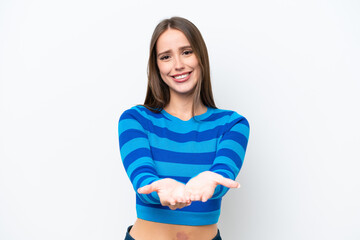 Fototapeta premium Young pretty caucasian woman isolated on white background holding copyspace imaginary on the palm to insert an ad