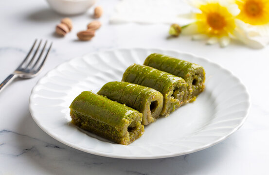 Pistachio baklava. Traditional Middle Eastern Flavors. The local name of Baklava is Fıstıklı Baklava or fıstıklı dolama. Turkish style pistachio baklava presentation and service