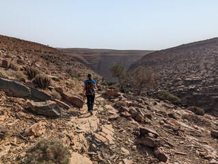 Obraz premium Hiking through the stone desert near Amtoudi in the Anti-Atlas