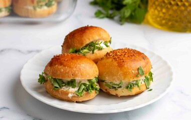 Turkish pastry filled with dill, parsley, cream cheese and cheddar cheese. Turkish name: Sakallı Pogaca or Saçaklı Pogaca