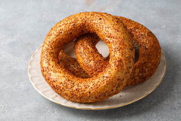 Turkish fast food bagel called Simit. Turkish bagel Simit with sesame. Bagel is traditional Turkish bakery food. Turkish name; simit - gevrek