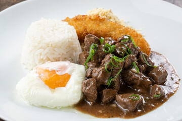 minced meat, typical Brazilian dish. Minced meat with sauce, rice, poached egg, farrofa and fried banana