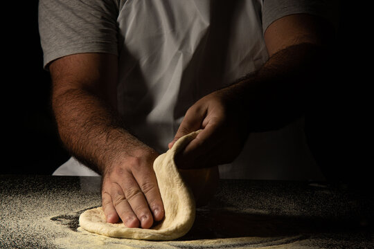 pizza maker preparing pizza dough