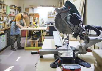 Fototapeta premium handsome skilful woodworker