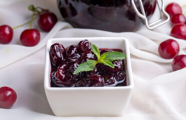 Jars with freshly homemade cherry jam, sour cherry jam, Turkish name; Visne receli