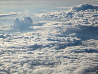 Fototapeta na wymiar Flying high over a scenic cloudscape