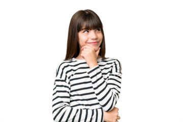 Little caucasian girl over isolated background thinking an idea while looking up