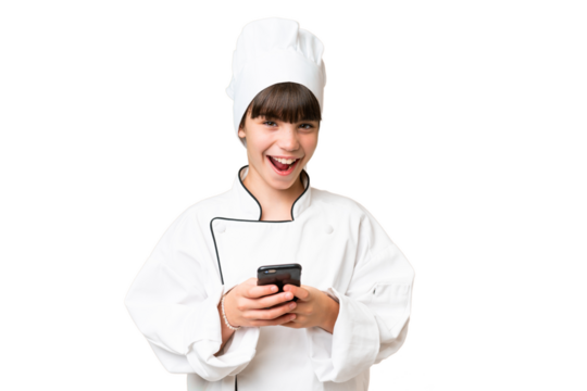 Little caucasian chef girl over isolated background surprised and sending a message