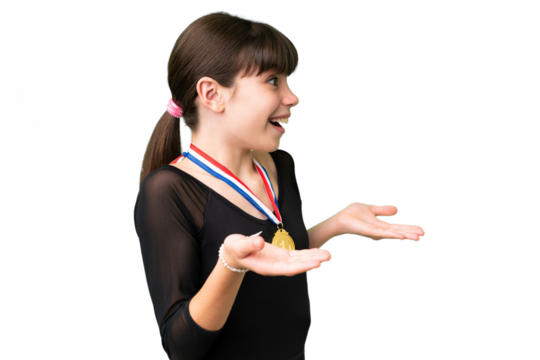 Little caucasian girl with medals over isolated background with surprise facial expression