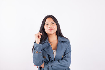 Fototapeta premium Portrait of young attractive hispan woman on a light background of photographic studio. Concept of people.