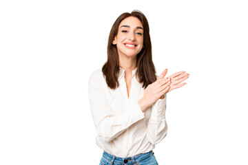 Young caucasian woman over isolated chroma key background applauding after presentation in a...