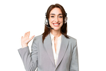 Telemarketer caucasian woman working with a headset over isolated chroma key background saluting with hand with happy expression