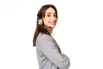Telemarketer caucasian woman working with a headset over isolated chroma key background with arms crossed and looking forward