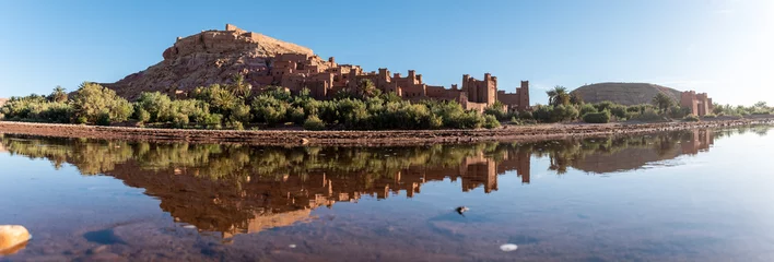 Fotobehang Sunrise over the beautiful historic town Ait Ben Haddou, famous berber town with many kasbahs built of clay, UNESCO world heritage © imagoDens