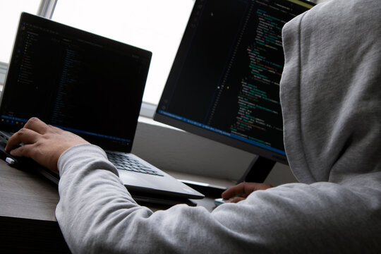 Hacker Working In Front Of A Window