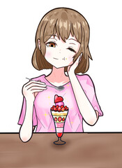 パフェを美味しそうに食べている女性