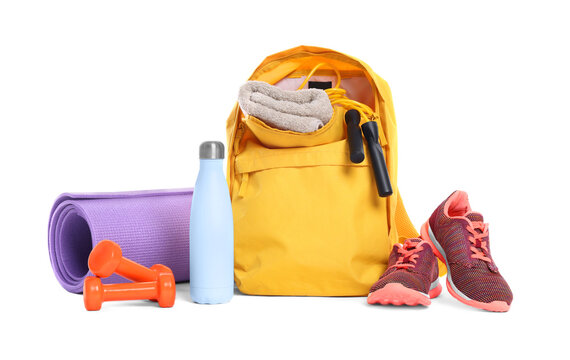 Backpack with sports equipment on white background