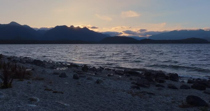 Aerial: wind over Lake at sunset, Manapouri, New Zealand