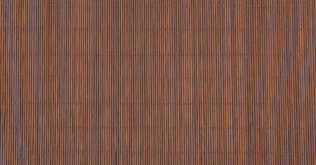 Texture of dark brown bamboo mat.Bamboo fine tablecloth background.