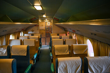 Vintage 1950s airliner in dim cabin lighting from a retro vacation that would be great for classic...