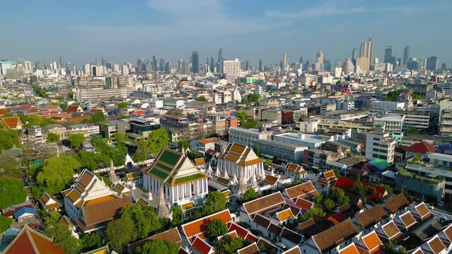 Aerial view of Bangkok Downtown Skyline, Thailand. Financial district and business centers in smart urban city in Asia. Skyscraper and high-rise buildings at sunset.