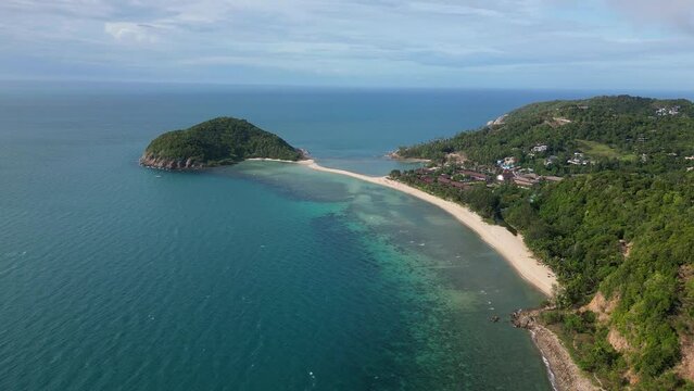 Ko Phangan, Thailand: Dramatic aerial drone video of the Haad Mae beach and island in the Koh Pha Ngan island in the gulf of Thailand in Southeast Asia. Shot with a rotation motion. 