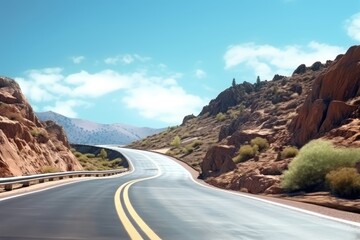 Winding Asphalt Road Through Red Rock Mountainscape, Bright Sunny Day