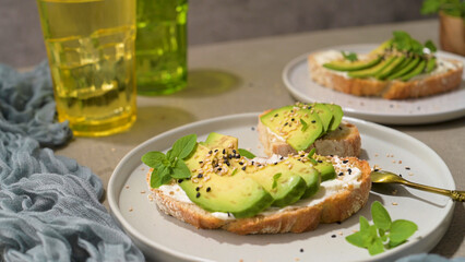 Toast with avocado cream cheese and wheat bread