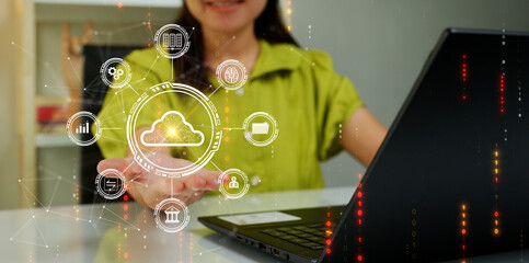 Woman uploading and transferring data from computer to cloud computing. Digital technology concept,...