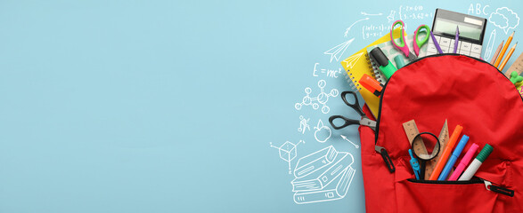 School backpack with stationery on light blue background with space for text, top view