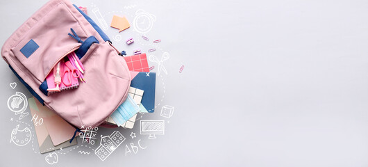 School backpack and stationery on light background with space for text, top view