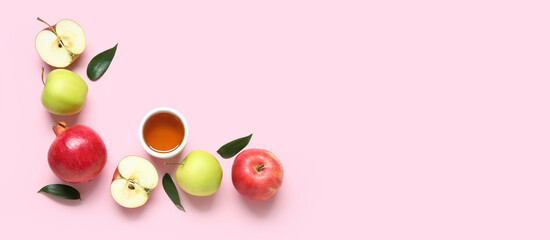 Ripe pomegranates, apples and honey on pink background with space for text. Rosh Hashanah (Jewish New Year) celebration