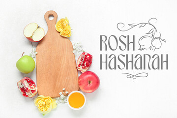Greeting card for Rosh Hasahanh (Jewish New Year) with apples, pomegranates, honey and flowers