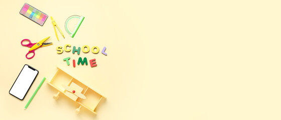 Text SCHOOL TIME made of letters with stationery, toy and mobile phone on light yellow background. Banner for design