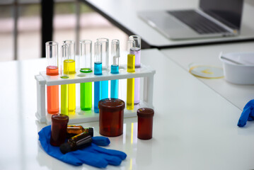 Chemical tubes meticulously organized and neatly arranged sat atop the table their contents safely stored within awaiting their purpose in various scientific endeavors.
