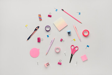 Composition with stationery supplies on grey background