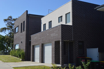 A view of a house in the suburbs on a sunny afternoon