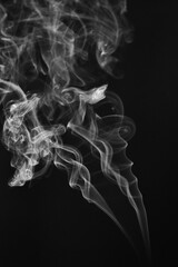 White smoke isolated on black background.