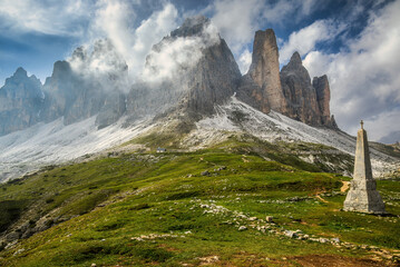 Fototapeta na wymiar Floating clouds around the peaks of the Tre Cime di Lavaredo in the Italian Dolomites