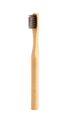 Bamboo tooth brush on white background