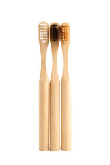 Bamboo tooth brushes on white background