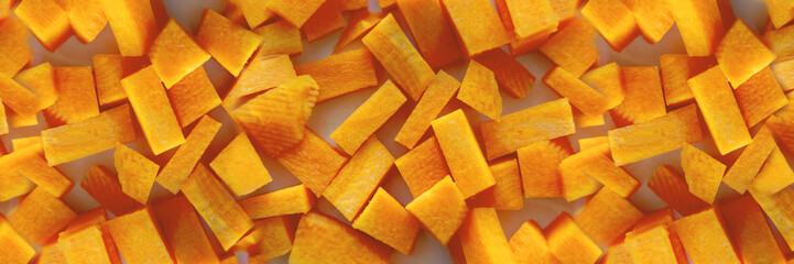 carrot cut into cubes close-up. A set of vitamins. Vegan food. Healthy food. Horizontal image....