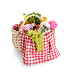 Wicker basket with tasty food for picnic, juice and peony flowers on white background