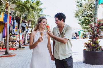 hispanic young couple of tourists shopping on vacations or holidays in Mexico Latin America,...
