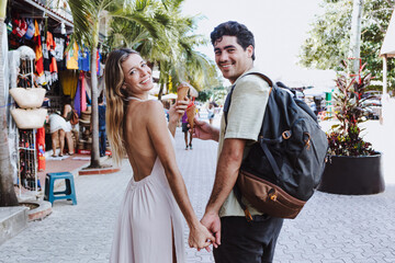 hispanic young couple of tourists shopping on vacations or holidays in Mexico Latin America,...