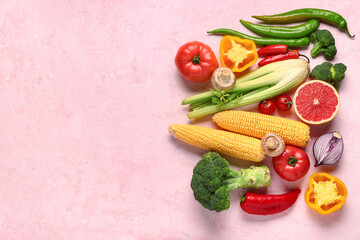 Fototapeta na wymiar Fresh ripe vegetables on pink background