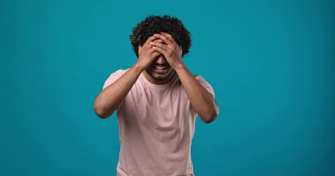 Frustrated indian man raising his hands and shrugging his shoulders with an indignant expression, asking the reason for the failure, showing disappointment, chagrin due to problems
