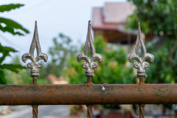 Old metal fashion fence. Decorative wrought iron fence.