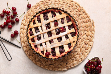 Baking dish with tasty cherry pie and bowl of berries on white background