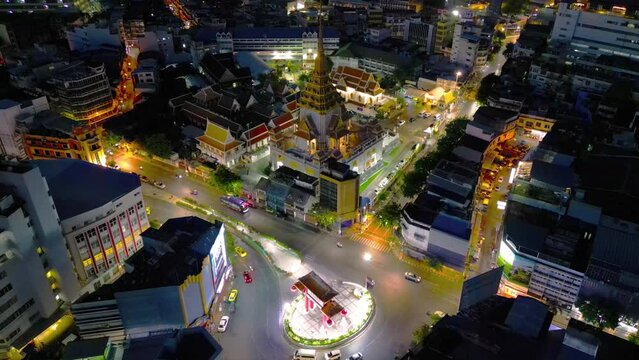 Aerial top view of Wat Ratchanatdaram pagoda, a buddhist temple or Wat Saket in Bangkok Downtown, urban city with sunset sky, Thailand. Thai architecture landscape background.